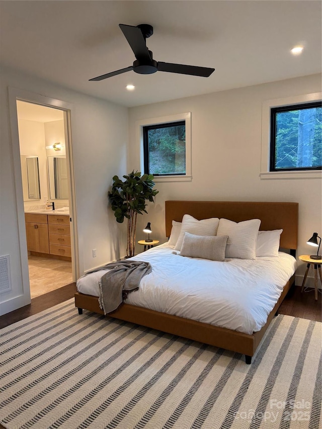 285 Poplar Crest Dr, Pisgah Forest, NC 28768 - bedroom featuring wood finished floors, ensuite bath, recessed lighting, and a ceiling fan