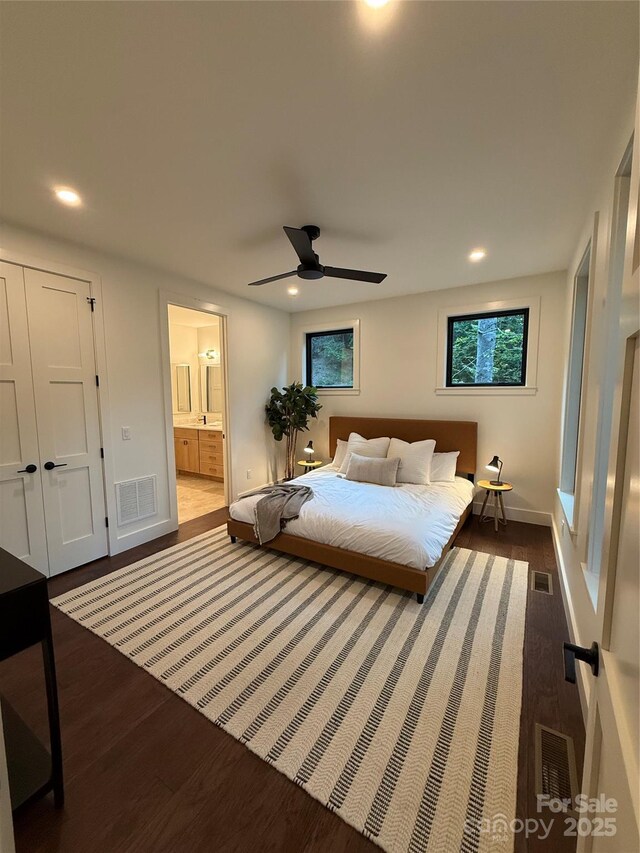 285 Poplar Crest Dr, Pisgah Forest, NC 28768 - bedroom with dark wood finished floors, recessed lighting, multiple windows, connected bathroom, and ceiling fan