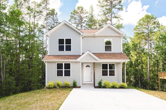 2206 Hillcrest Ave, Albemarle, NC 28001 - view of front of home with a shingled roof and a front yard
