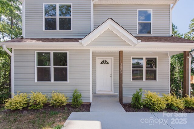2206 Hillcrest Ave, Albemarle, NC 28001 - view of front facade with a shingled roof and a porch