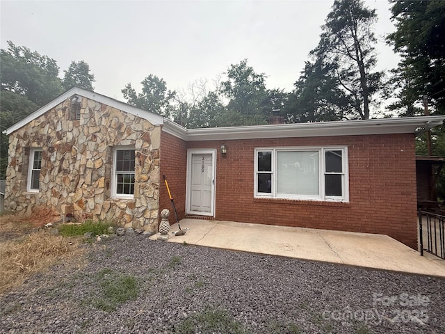 3166 Poplar Tent Rd, Concord, NC 28027 - ranch-style home featuring a patio area, brick siding, and stone siding