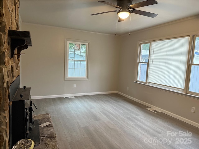 3166 Poplar Tent Rd, Concord, NC 28027 - unfurnished living room with ornamental molding, ceiling fan, healthy amount of natural light, and wood finished floors