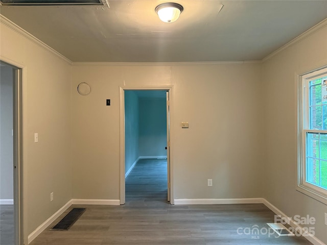 3166 Poplar Tent Rd, Concord, NC 28027 - unfurnished room with wood finished floors, ornamental molding, and healthy amount of natural light