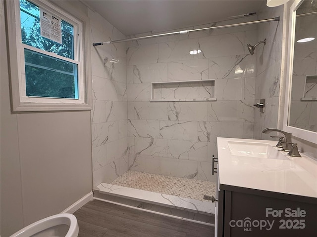 3166 Poplar Tent Rd, Concord, NC 28027 - bathroom with vanity, a tile shower, and wood finished floors