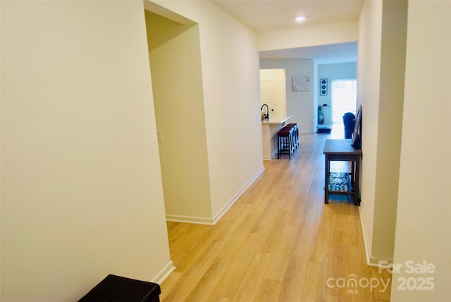 12209 Riceland Way, Midland, NC 28107 - hallway featuring light wood finished floors and recessed lighting