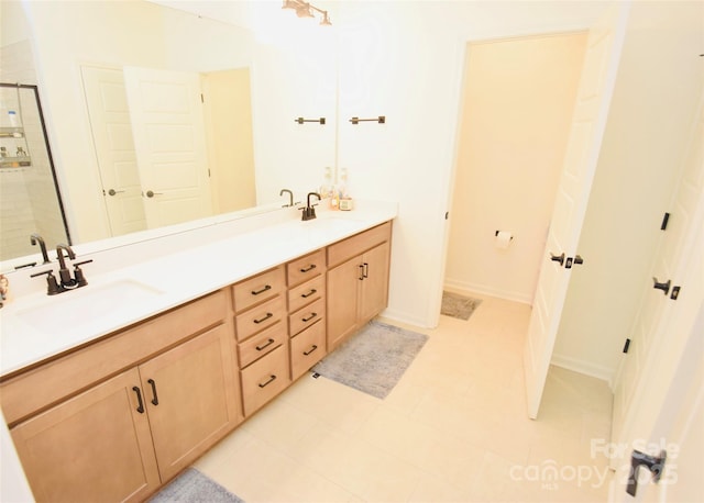 12209 Riceland Way, Midland, NC 28107 - bathroom featuring double vanity and tiled shower