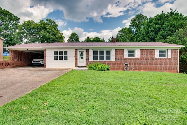 2310 Honeysuckle Pl, Lenoir, NC 28645 - single story home with driveway, a front lawn, a metal roof, a carport, and a chimney