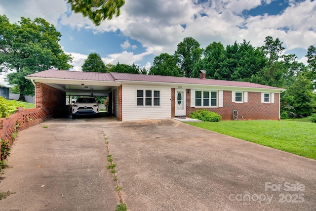 2310 Honeysuckle Pl, Lenoir, NC 28645 - ranch-style house featuring an attached carport, concrete driveway, brick siding, and a metal roof