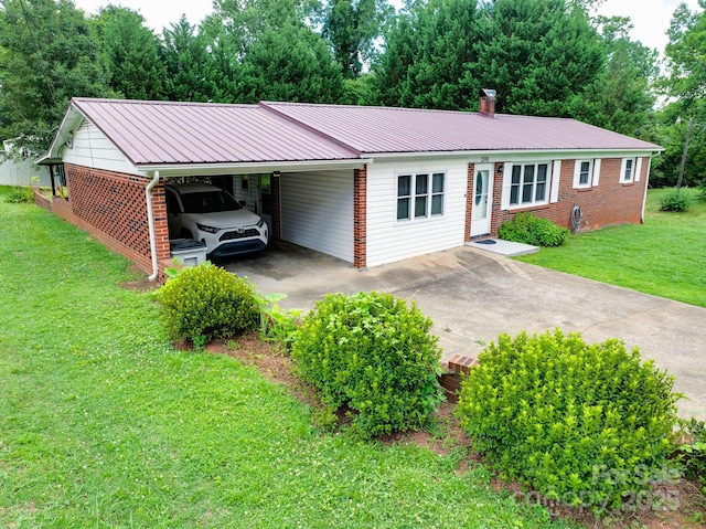 2310 Honeysuckle Pl, Lenoir, NC 28645 - single story home featuring concrete driveway, a carport, brick siding, a metal roof, and a front yard