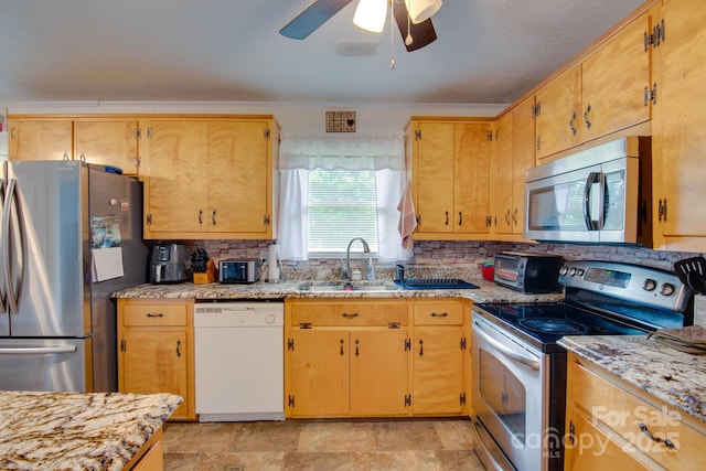 2310 Honeysuckle Pl, Lenoir, NC 28645 - kitchen featuring stainless steel appliances, tasteful backsplash, and a ceiling fan
