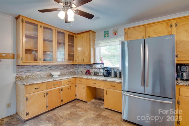 2310 Honeysuckle Pl, Lenoir, NC 28645 - kitchen with freestanding refrigerator, tasteful backsplash, ceiling fan, glass insert cabinets, and stone finish flooring