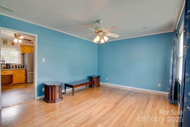 2310 Honeysuckle Pl, Lenoir, NC 28645 - empty room with a ceiling fan, light wood-style floors, and ornamental molding