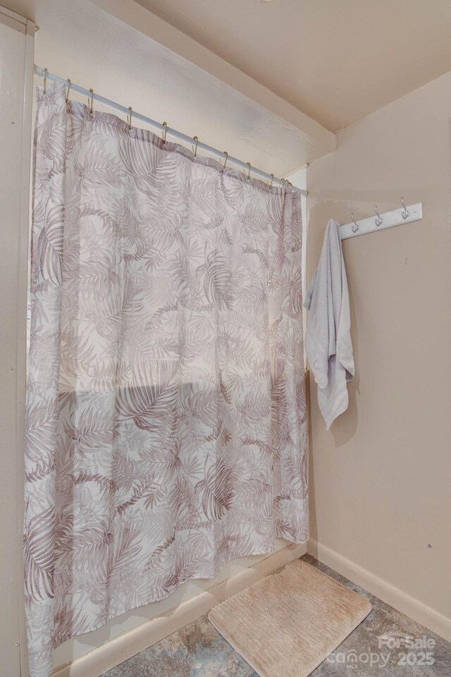 2310 Honeysuckle Pl, Lenoir, NC 28645 - bathroom with baseboards and curtained shower