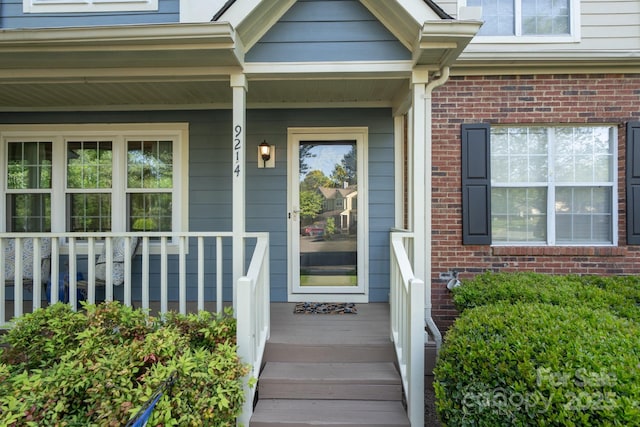 9214 Arbourgate Meadows Ln, Charlotte, NC 28277 - doorway to property with a porch and brick siding