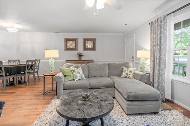 9214 Arbourgate Meadows Ln, Charlotte, NC 28277 - living area featuring light wood finished floors, crown molding, and a ceiling fan