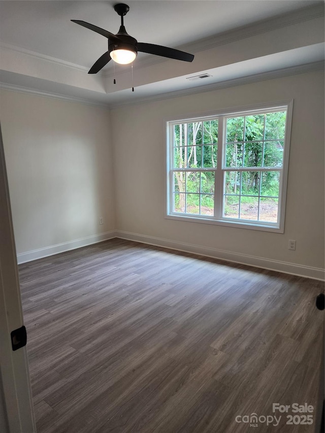 723 Taylor St, Rock Hill, SC 29730 - spare room featuring ornamental molding, dark wood-type flooring, a ceiling fan, and a tray ceiling