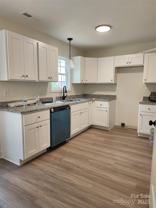 723 Taylor St, Rock Hill, SC 29730 - kitchen with dishwashing machine, white cabinetry, light wood-type flooring, and hanging light fixtures