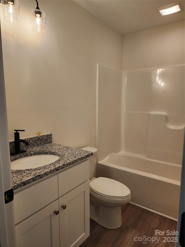 723 Taylor St, Rock Hill, SC 29730 - full bath featuring vanity, wood finished floors, and washtub / shower combination