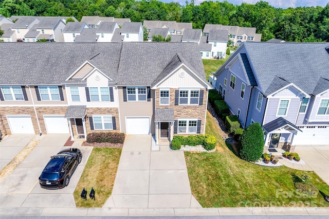 365 Battery Cir, Clover, SC 29710 - view of front facade featuring stone siding, driveway, a residential view, and an attached garage