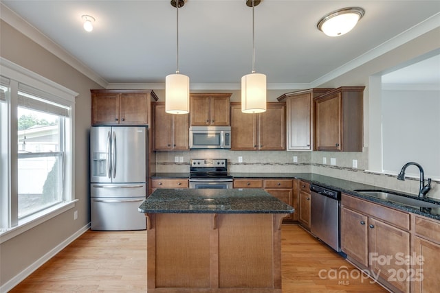 365 Battery Cir, Clover, SC 29710 - kitchen featuring stainless steel appliances, brown cabinets, a center island, dark stone counters, and backsplash