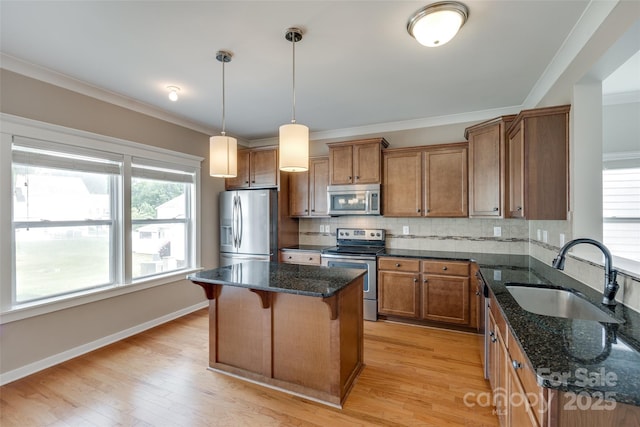 365 Battery Cir, Clover, SC 29710 - kitchen featuring stainless steel appliances, brown cabinetry, a kitchen bar, a kitchen island, and ornamental molding
