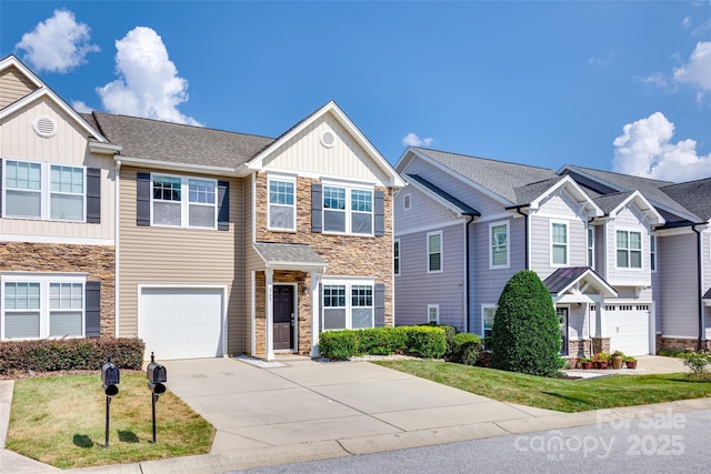 365 Battery Cir, Clover, SC 29710 - craftsman-style home with stone siding, board and batten siding, driveway, a garage, and a front lawn