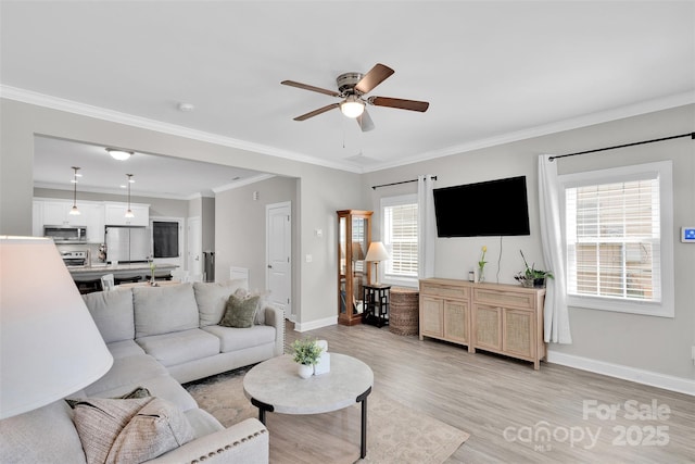 2662 14th St NE, Hickory, NC 28601 - living room featuring ceiling fan, light wood-type flooring, and crown molding