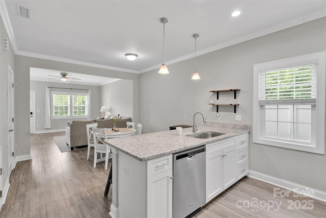 2662 14th St NE, Hickory, NC 28601 - kitchen with stainless steel dishwasher, a peninsula, open shelves, white cabinetry, and light wood-style flooring