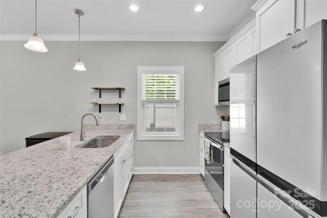 2662 14th St NE, Hickory, NC 28601 - kitchen with stainless steel appliances, ornamental molding, open shelves, white cabinets, and light wood-style flooring