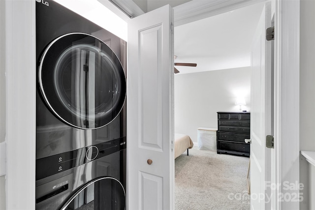 2662 14th St NE, Hickory, NC 28601 - washroom with estacked washer and dryer, carpet flooring, and ceiling fan