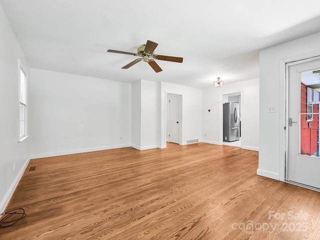 123 Blake Dr, Arden, NC 28704 - unfurnished living room featuring light wood-type flooring and a ceiling fan