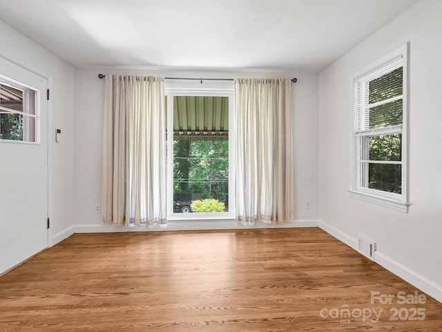 123 Blake Dr, Arden, NC 28704 - spare room with healthy amount of natural light and light wood-type flooring