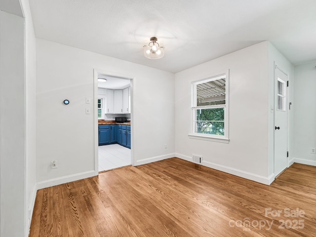 123 Blake Dr, Arden, NC 28704 - unfurnished room with plenty of natural light and light wood-style floors