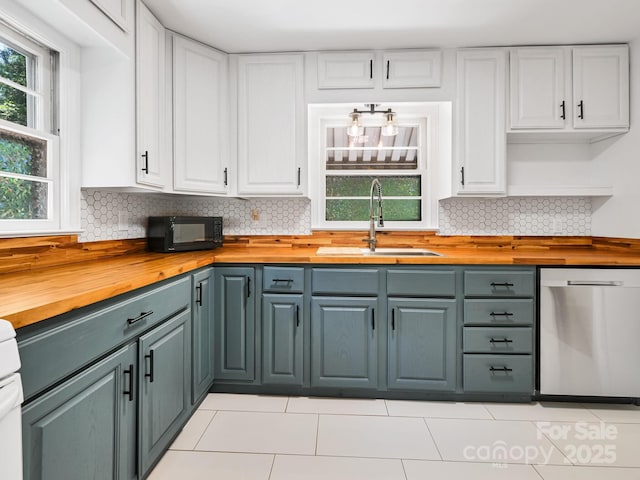 123 Blake Dr, Arden, NC 28704 - kitchen featuring butcher block counters, dishwasher, black microwave, and white cabinetry