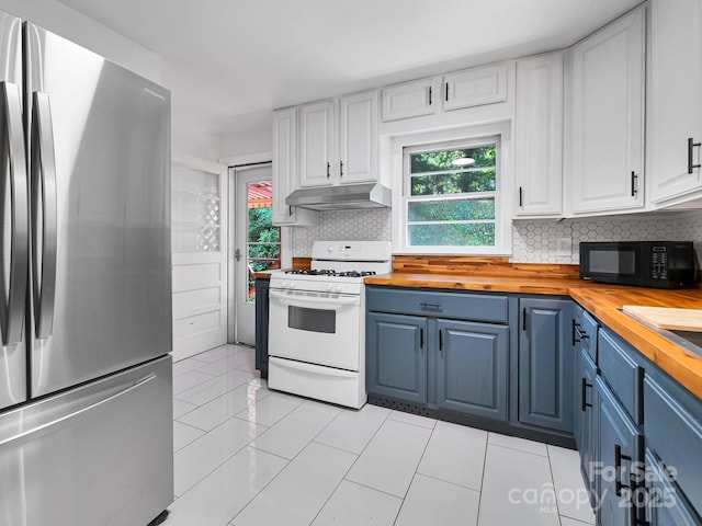 123 Blake Dr, Arden, NC 28704 - kitchen featuring freestanding refrigerator, butcher block countertops, white gas range, black microwave, and under cabinet range hood
