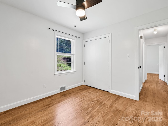 123 Blake Dr, Arden, NC 28704 - unfurnished bedroom featuring light wood finished floors, a closet, and ceiling fan