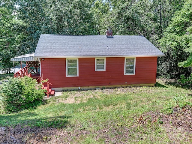 123 Blake Dr, Arden, NC 28704 - view of property exterior featuring a chimney, a shingled roof, and a lawn