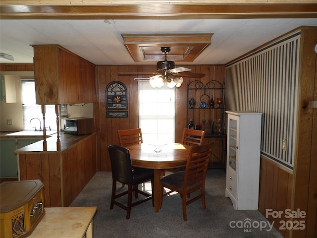 1475 Ferguson Dr, Clemmons, NC 27012 - dining room with wooden walls, carpet floors, and ceiling fan