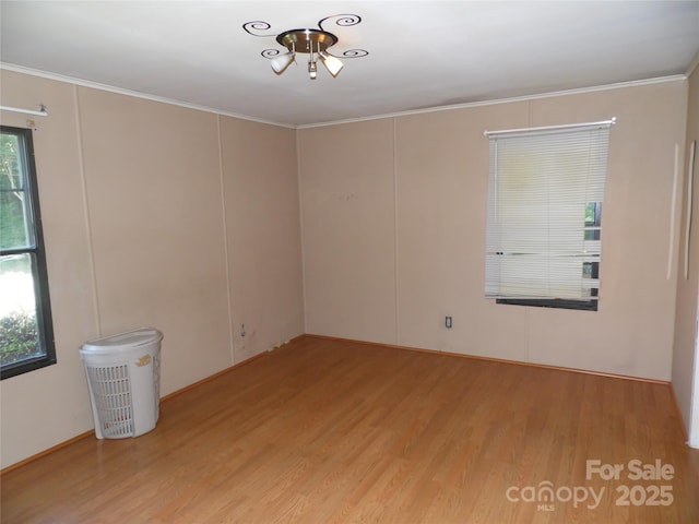 1475 Ferguson Dr, Clemmons, NC 27012 - spare room with light wood-style floors and ornamental molding