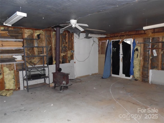 1475 Ferguson Dr, Clemmons, NC 27012 - below grade area with a wood stove and a ceiling fan