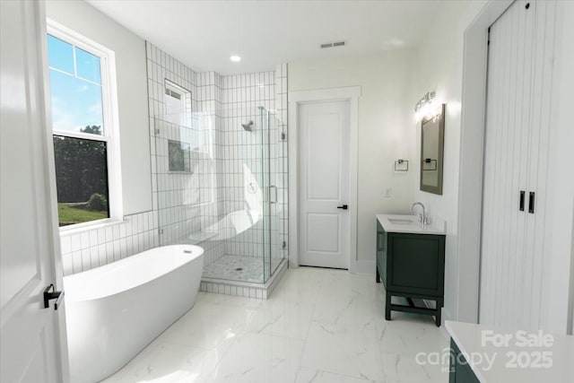 108 Augusta Ln, Shelby, NC 28150 - bathroom with vanity, a soaking tub, a shower stall, and marble finish flooring