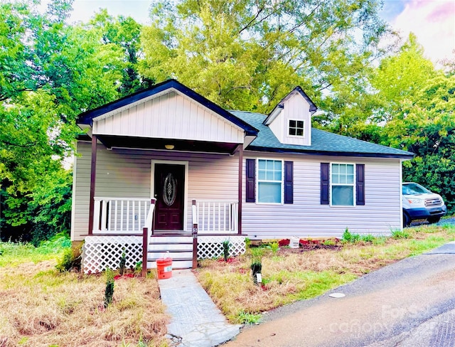 511 Lodge St, Wadesboro, NC 28170 - bungalow featuring a porch and roof with shingles