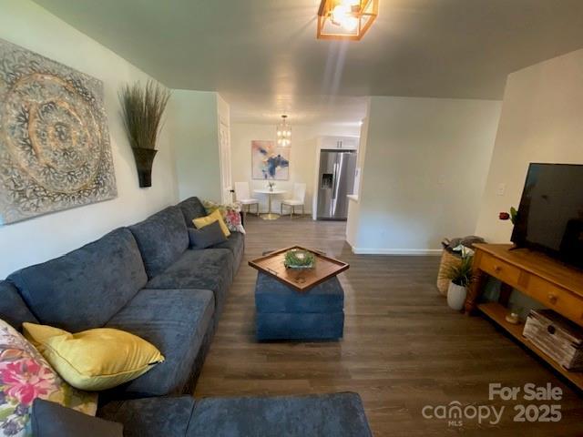 9800 Feldbank Dr, Charlotte, NC 28216 - living area featuring wood finished floors and a chandelier