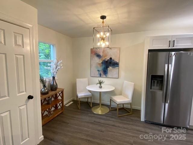 9800 Feldbank Dr, Charlotte, NC 28216 - living area featuring dark wood-type flooring and a chandelier