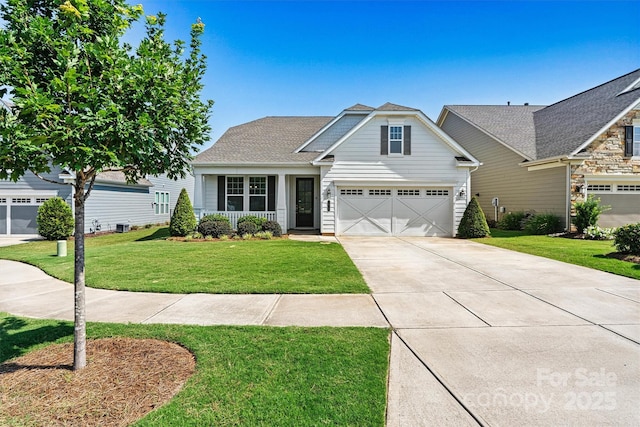 7315 Surprise Ct, Charlotte, NC 28215 - view of front of home featuring concrete driveway, a front lawn, and an attached garage