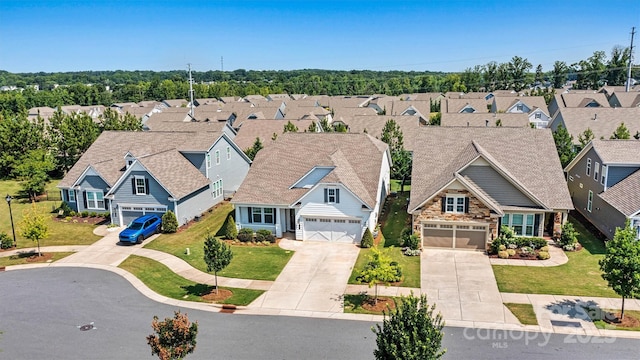 7315 Surprise Ct, Charlotte, NC 28215 - view of front of house with a residential view, concrete driveway, a garage, and stone siding