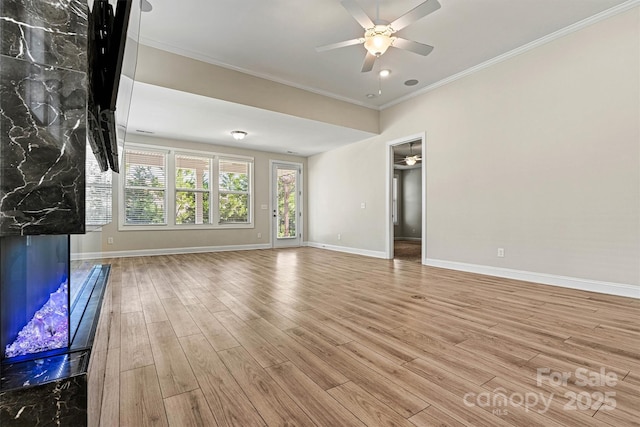 7315 Surprise Ct, Charlotte, NC 28215 - unfurnished living room with ceiling fan, wood finished floors, and crown molding