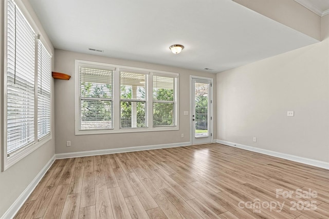 7315 Surprise Ct, Charlotte, NC 28215 - spare room with light wood-style flooring and healthy amount of natural light
