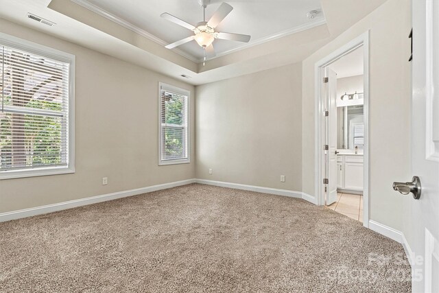 7315 Surprise Ct, Charlotte, NC 28215 - unfurnished room with ornamental molding, light colored carpet, and a ceiling fan