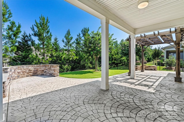 7315 Surprise Ct, Charlotte, NC 28215 - fenced backyard featuring a pergola, a patio area, a ceiling fan, and view of scattered trees